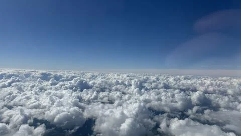 A blue sky over the clouds Stock Photos
