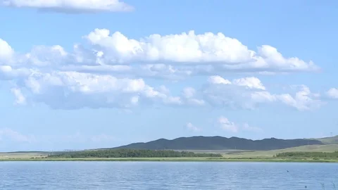 Blue sky over the lake Stock Footage 82302937
