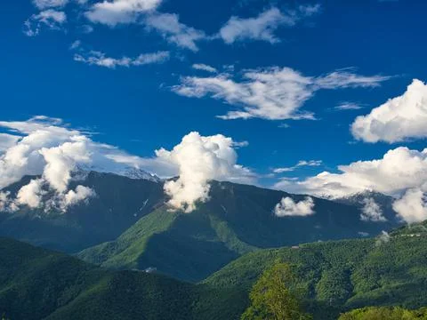 Blue sky over a mountain Stock Photos