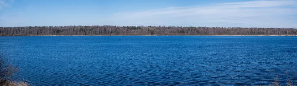 Blue sky over river on spring landscape. Neva river Stock Photos