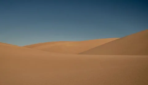 Blue Sky Over Three Dune Layers Stock Photos