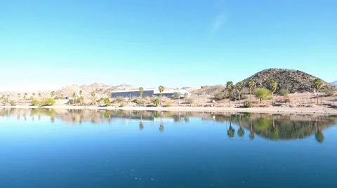 Blue Sky Palm Trees Reflecting in a Blue River Видео 49491103