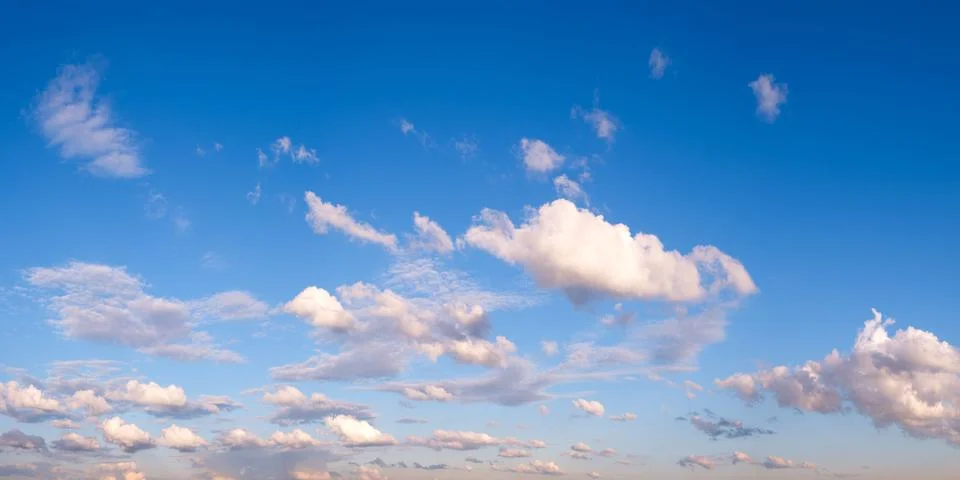 Blue sky panorama background with tiny clouds Stock Photos