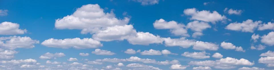 Blue sky panorama background with tiny clouds Stock Photos