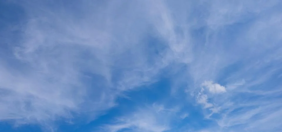 Blue sky panorama background with tiny clouds Stock Photos