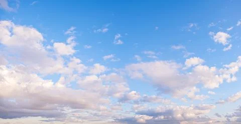 Blue sky panorama background with tiny clouds Stock Photos