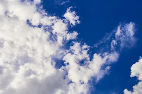 Blue sky with partial clound coverage for backgrounds and textures Stock Photos