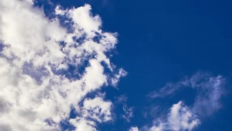 Blue sky with partial clound coverage for backgrounds and textures Fotos de archivo