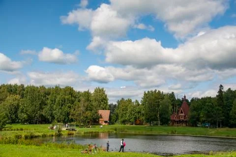 Blue sky in the pond reflection clouds and people walk in pleasure Stock Photos