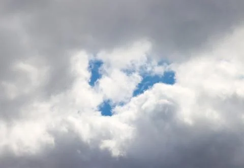 Blue sky in rain clouds. Stock Photos