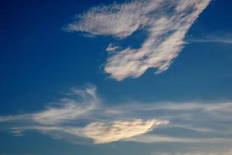 Blue sky with rainbow clouds Foto stock