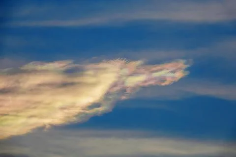 Blue sky with rainbow clouds Foto stock