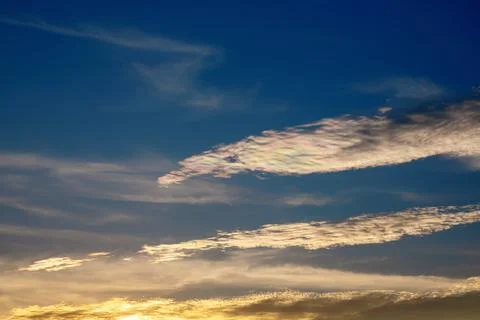 Blue sky with rainbow clouds Foto stock