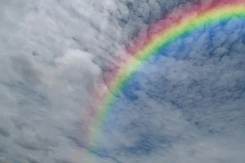 Blue sky with rainbow Stock Photos