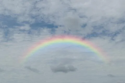 Blue sky with rainbow Foto stock
