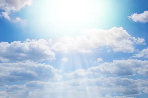 Blue sky with rays. Beautiful cloudy sky. Stock Photos