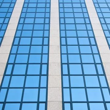 Blue sky reflected in grid of windows Stock Photos