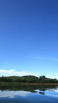Blue Sky Reflected on Water 스톡 사진