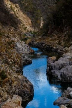 Blue sky reflection in river Stock Photos