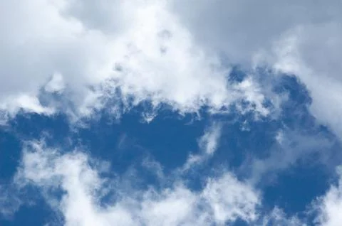 Blue sky saturated with clouds Stock Photos
