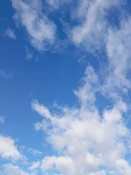 Blue Sky with Scattered Clouds Stock Photos