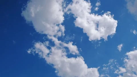 Blue sky with scattered white clouds, a clean natural background for weather,  Video stock 341473031