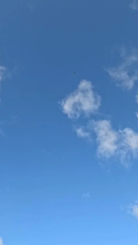 Blue Sky with Scattered White Clouds on a Sunny Day Stock Footage 345012541