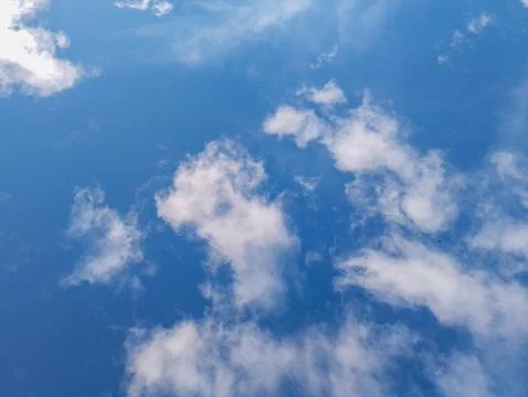 Blue Sky with Scattered White Clouds Stock Photos