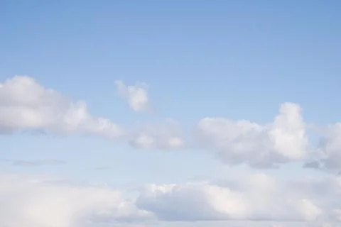 Blue Sky with Scattered White Clouds Stock Photos