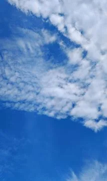Blue Sky with Scattered White Clouds Stock Photos