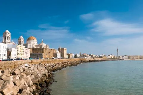 Blue sky, seafront and the Cathedral Campo del Sur in Cadiz, Spain Stock Photos