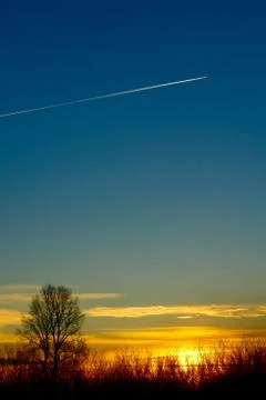 Blue sky, setting sun Stock Photos