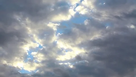 Blue sky shinning through dramatic clouds Stock Footage 80440355