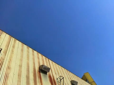 Blue sky from side the building Stock Photos