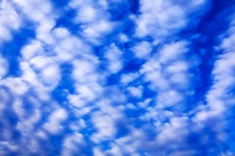 Blue sky with small white clouds Stock Photos