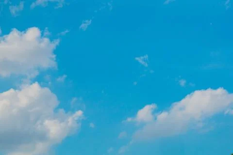Blue sky with small white clouds Stock Photos