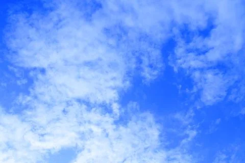 Blue Sky with Small White Clouds Stock Photos