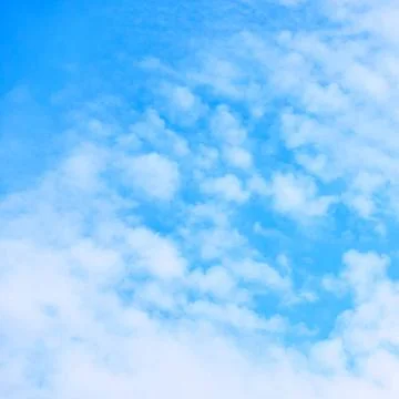 Blue sky with small white fleecy cloud Only blue sky with small white flee... Stock Photos
