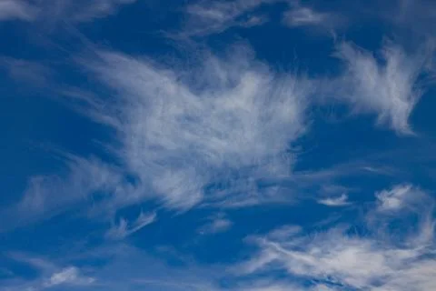 A blue sky with soft clouds. Background texture Stock Photos