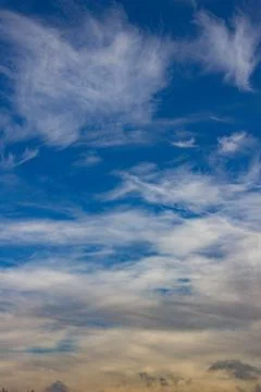 Blue sky with soft clouds. Vertical orientation. Stock Photos