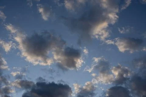 Blue Sky with Soft Cumulus Clouds at Sunset Stock Photos
