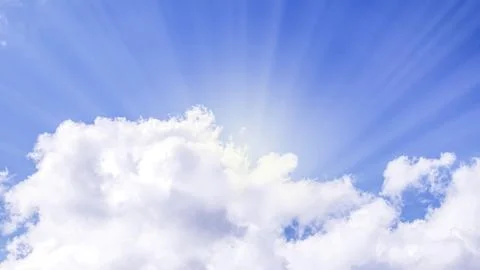 Blue sky with soft fluffy clouds and rays of the sun, Copy space Stock Photos