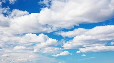 Blue sky with soft white clouds in sunny day Stock Photos