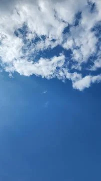Blue sky with soft white clouds Stock Photos
