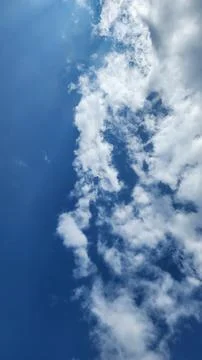 Blue sky with soft white clouds Foto stock