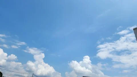 Blue sky with soft white clouds Stock Photos