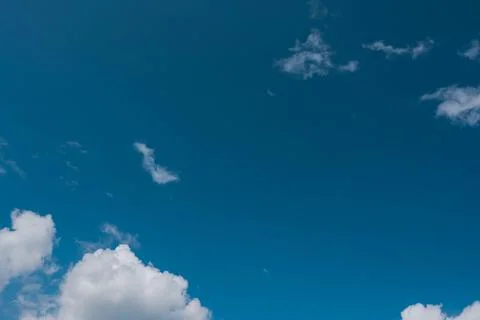 Blue sky with soft white clouds Stock Photos
