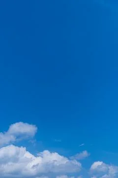 Blue sky with soft white clouds Stock Photos