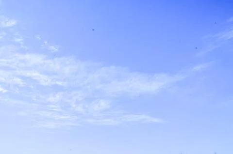 Blue Sky With Soft Wispy Clouds Stock Photos