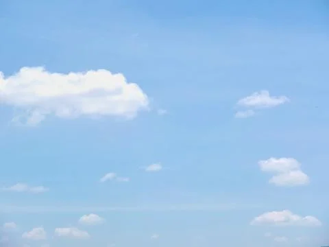 Blue sky with some clouds Stock Photos